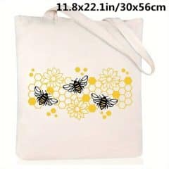 white tote bag with bees and honeycomb
